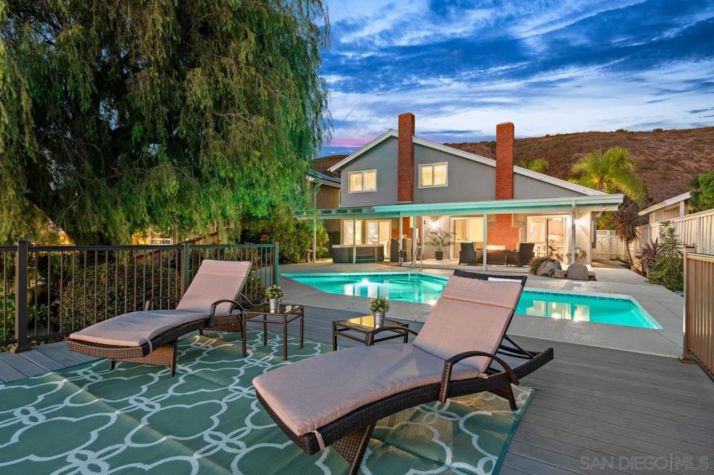 Twilight at Quinton Road, with a pool, garden and outdoor living space